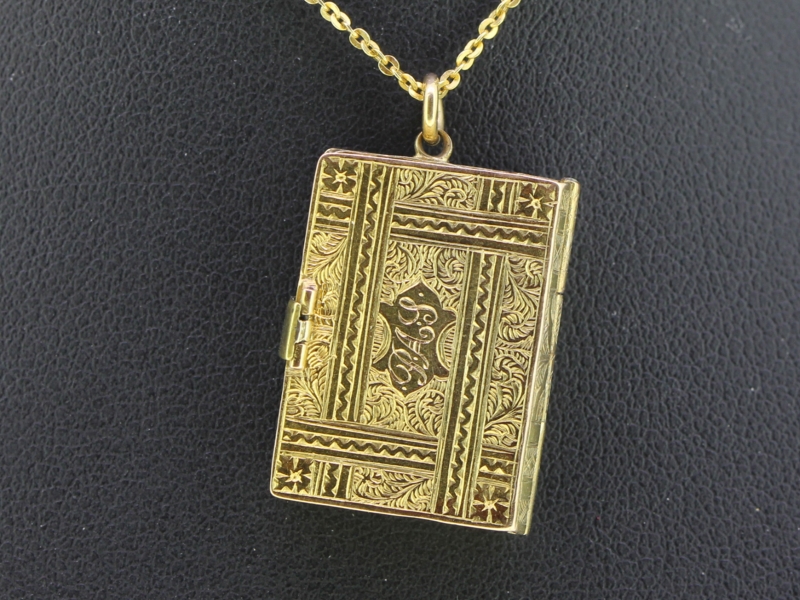 A charming 15 carat gold book locket 