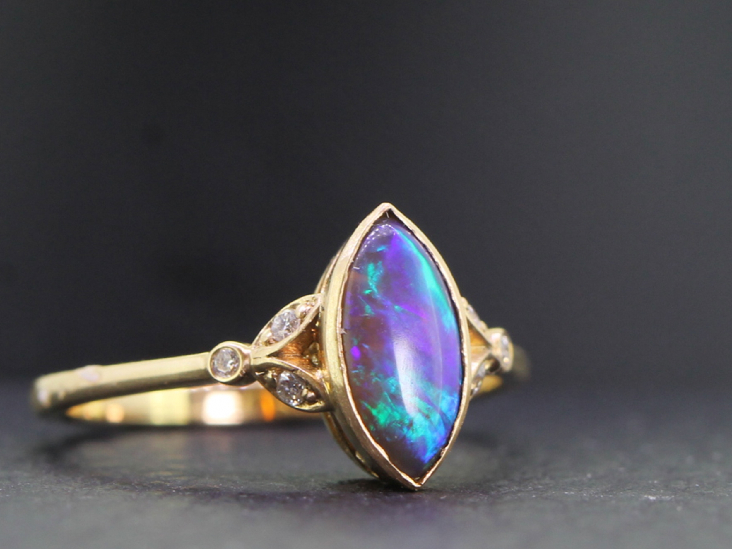 Stunning solid black opal and diamond 14 carat ring