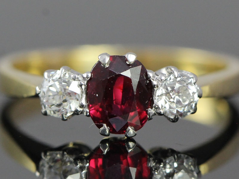 Beautiful ruby and diamond trilogy 18 carat gold ring