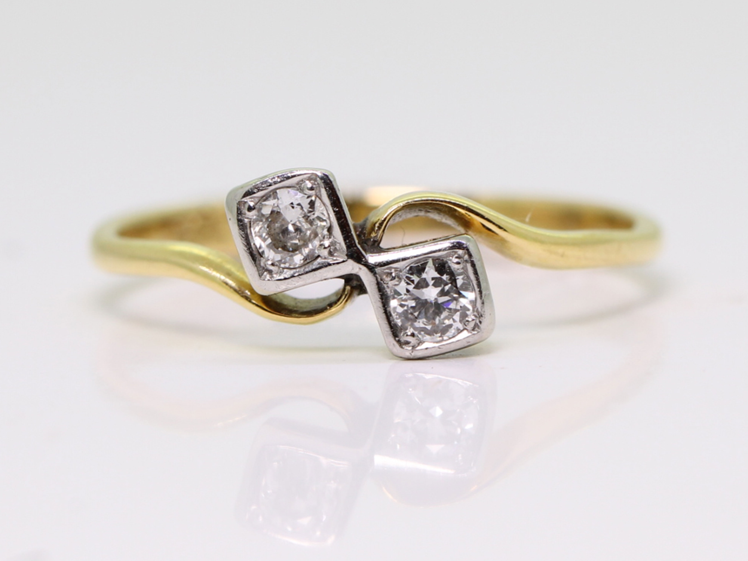 Edwardian cross over diamond platinum and 18ct gold ring