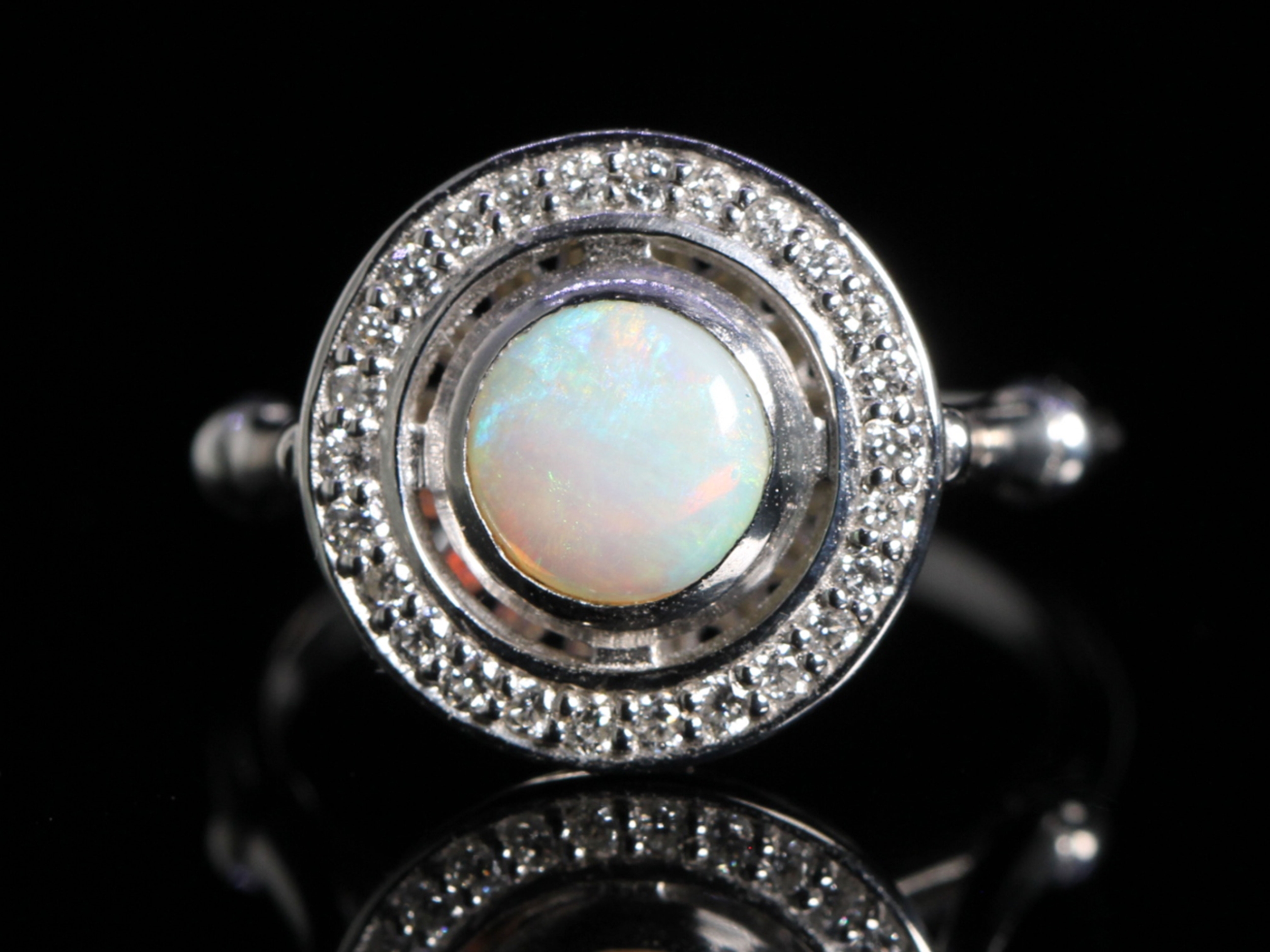 Art deco style opal and diamond 18ct gold ring