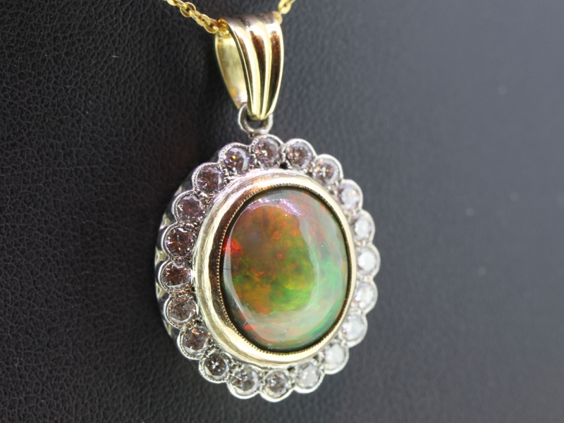 Stunning black opal and diamond gold and silver pendant