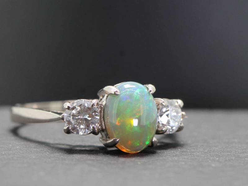 Fabulous black opal and diamond platinum trilogy ring