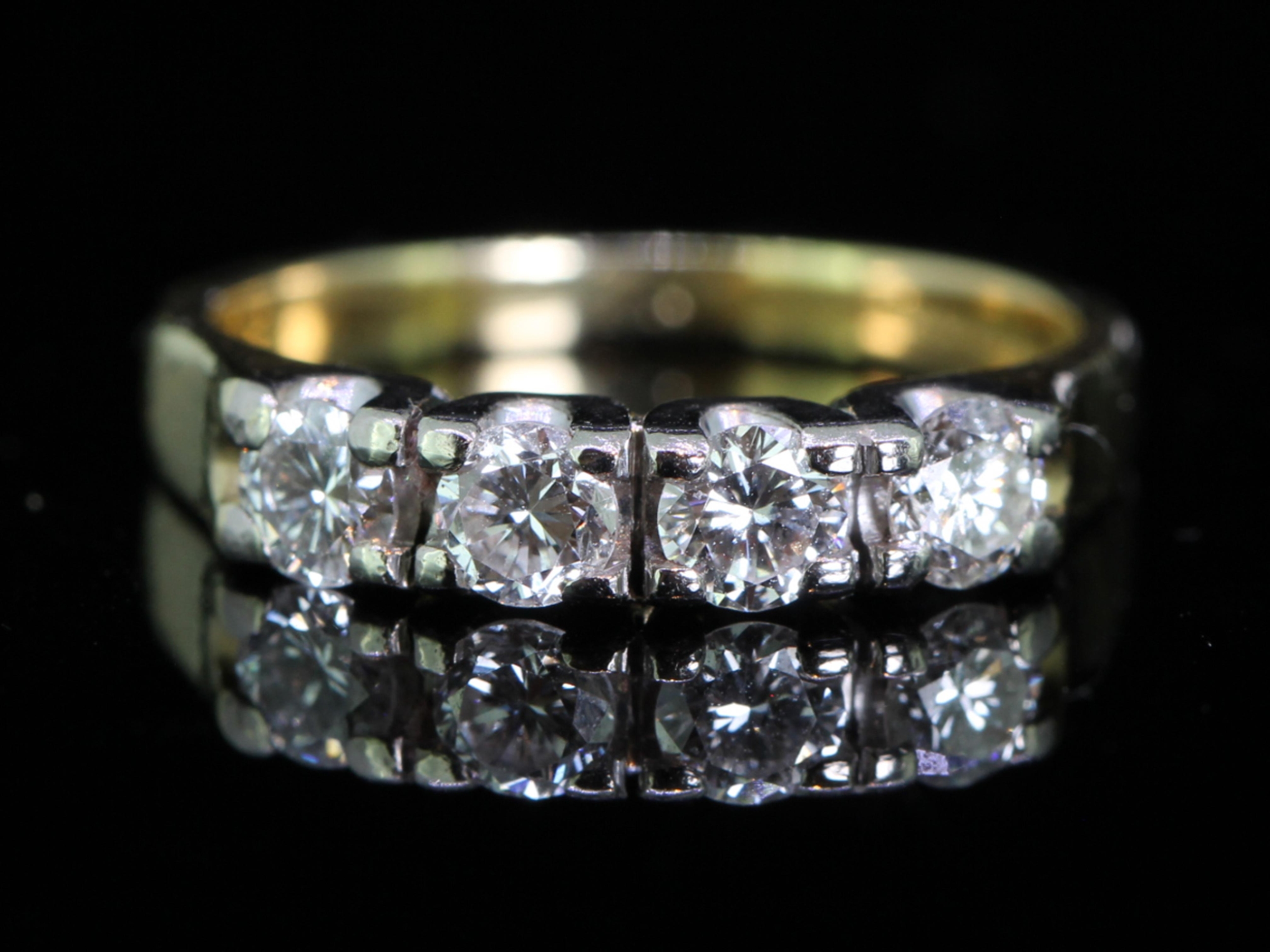 Four stone diamond 18 carat gold half eternity ring