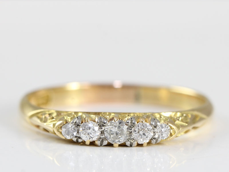 Pretty edwardian five stone diamond 18 carat gold ring