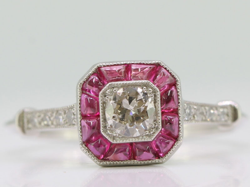 Art deco inspired diamond and ruby platinum target ring