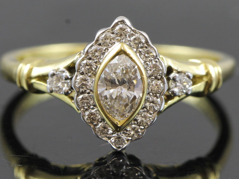 Elegant marquise cut diamond cluster 18 carat ring