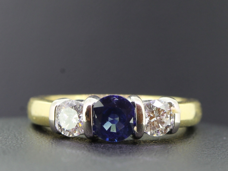 Timeless three stone sapphire and diamond 18 carat gold ring