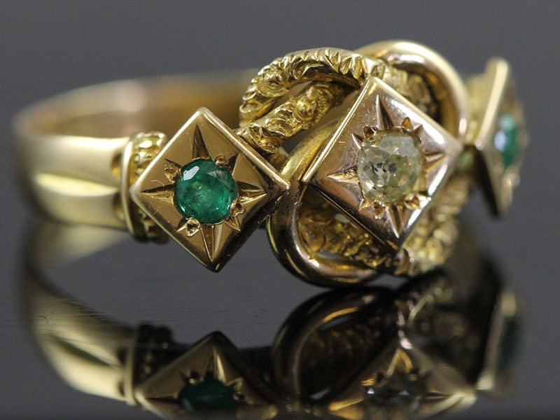Wonderful diamond and emerald 18 carat gold knot ring