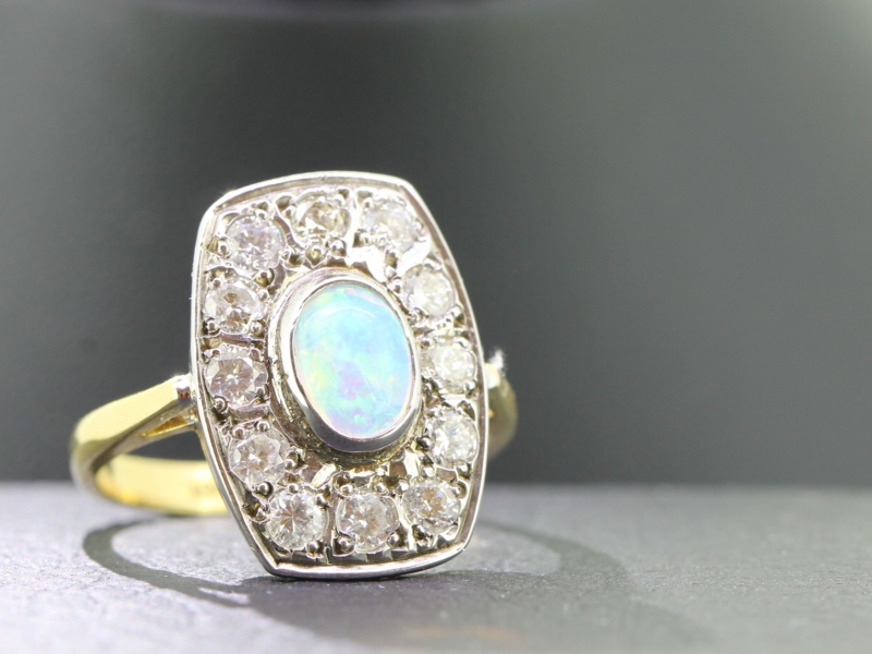 Glorious opal and diamond 18 carat gold ring