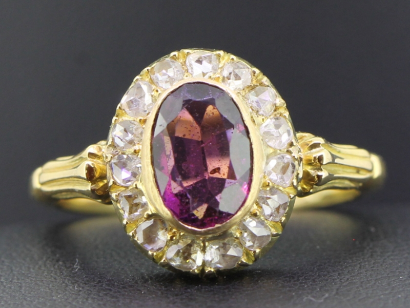 Sophisticated almandine garnet and diamond 18 carat gold cluster ring