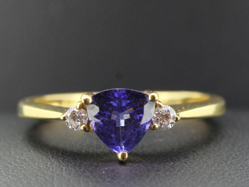 Gorgeous tanzanite and diamond 18 carat gold trilogy ring