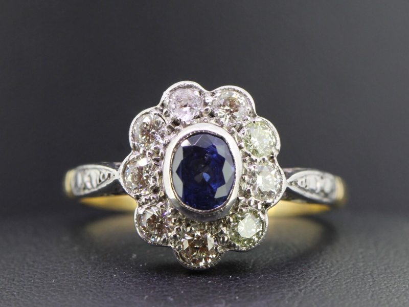 Elegant sapphire and diamond platinum and 18 carat gold cluster ring