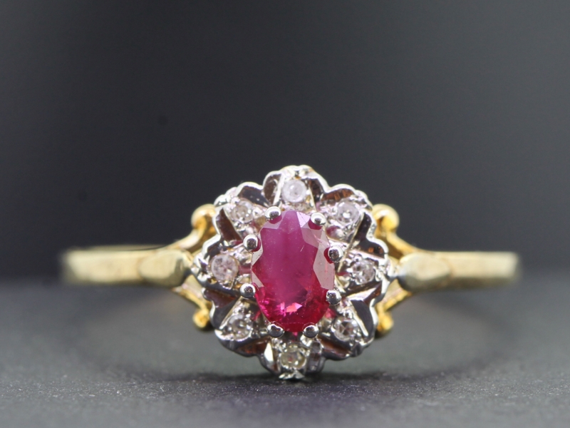 Pretty ruby and diamond 9 carat gold cluster ring