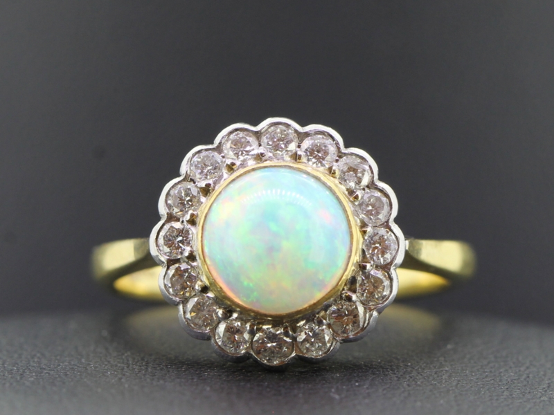 Beautiful australiain opal and diamond cluster 18 carat gold ring