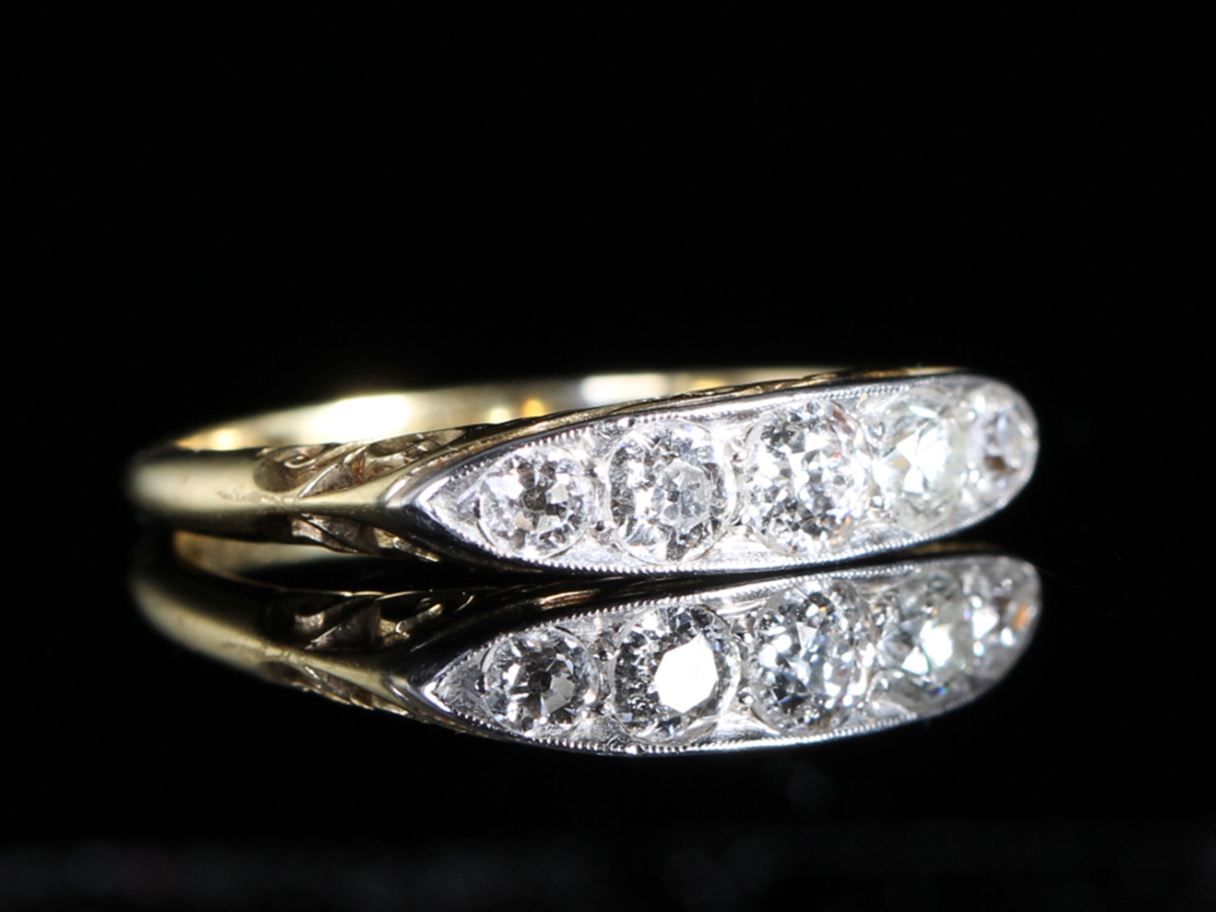 Edwardian carved half hoop five stone diamond ring