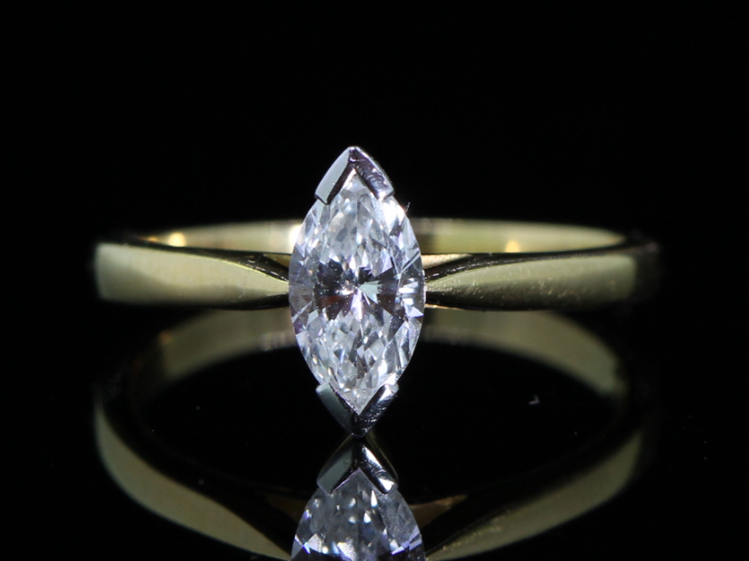 Contemporary 0.60ct marquise cut diamond solitaire 18ct gold ring