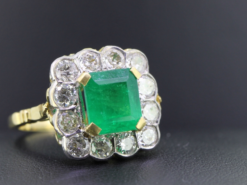 Alluring emerald and diamond 18 carat gold cluster ring