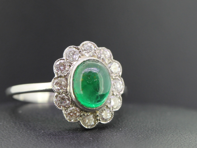 Elegant cabochon colombian emerald and diamond platinum cluster ring 