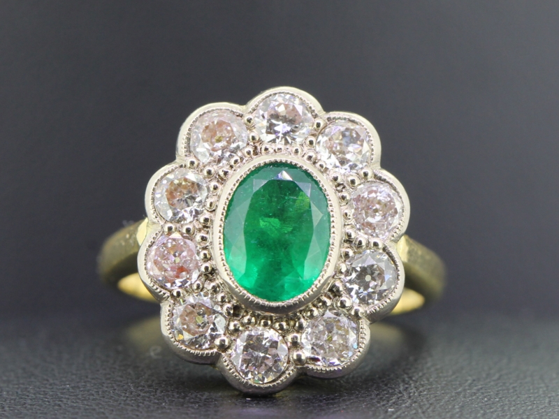 Elegant emerald and diamond 18 carat gold cluster ring 