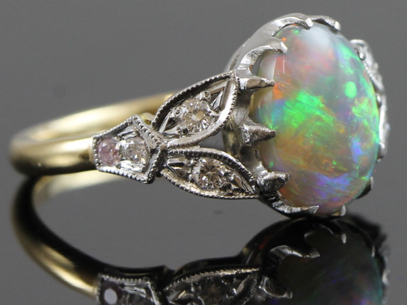 Wonderful opal and diamond 18 carat gold ring
