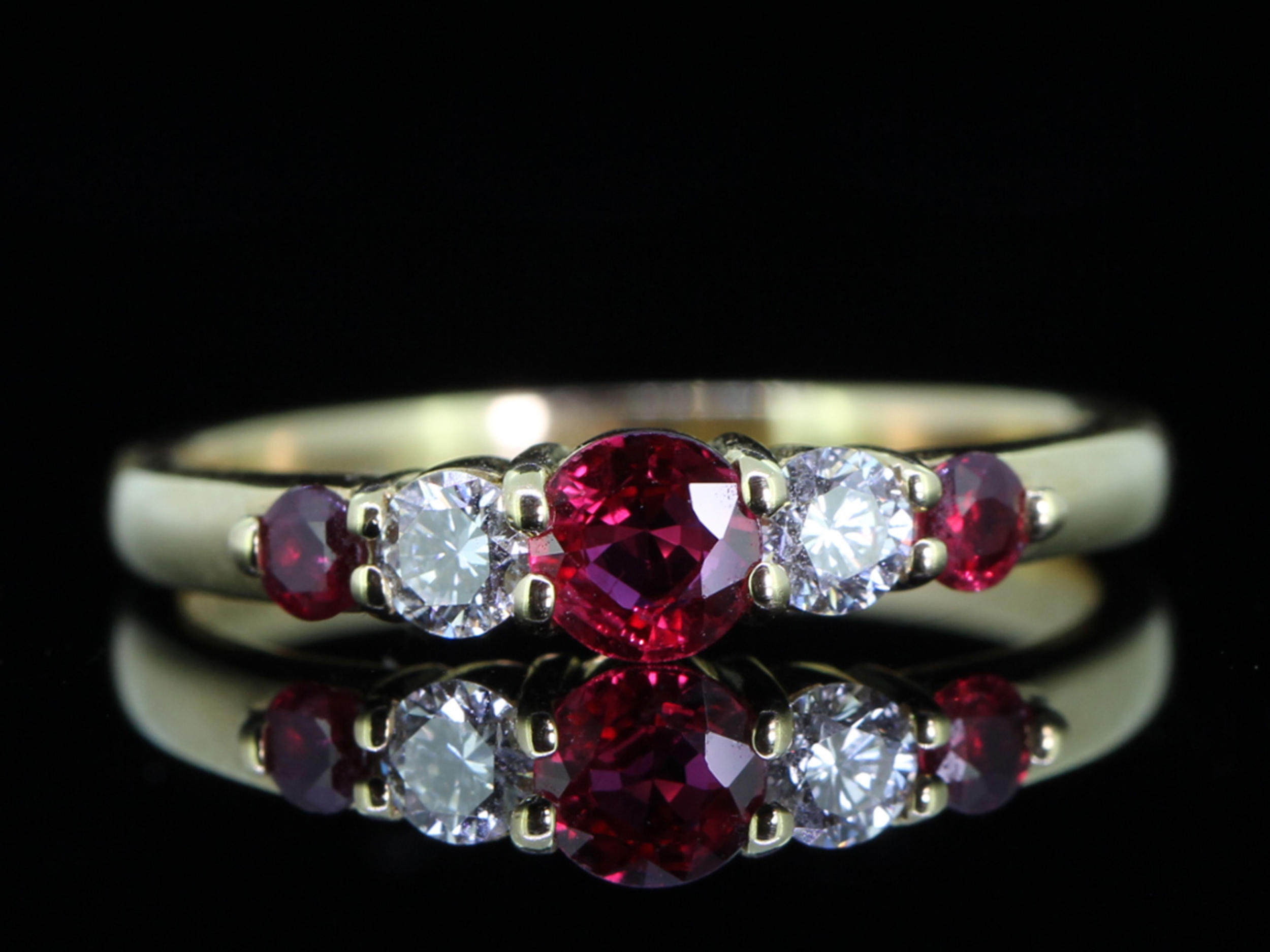 Radiant natural ruby and diamond 18 carat gold five stone ring