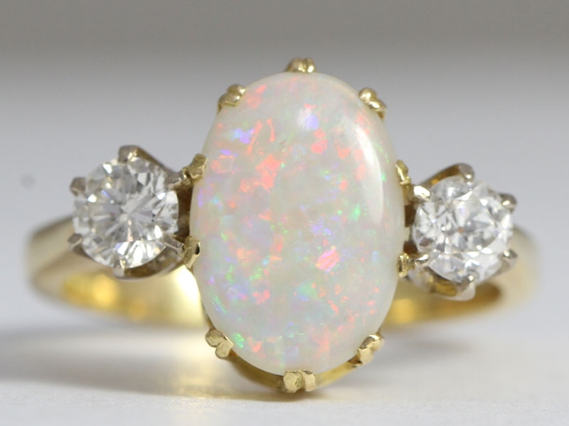 Fabulous opal and diamond trilogy 18 carat gold ring