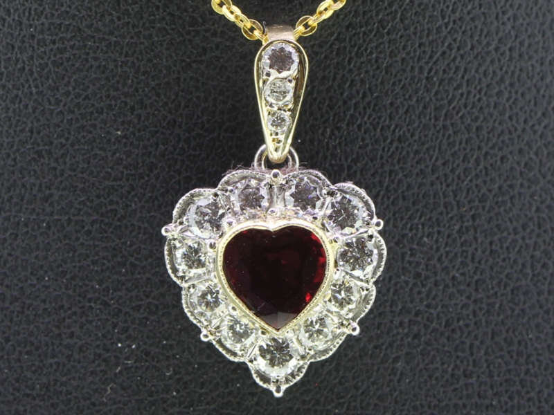 Elegant ruby and diamond platinum and 18 carat gold heart pendant