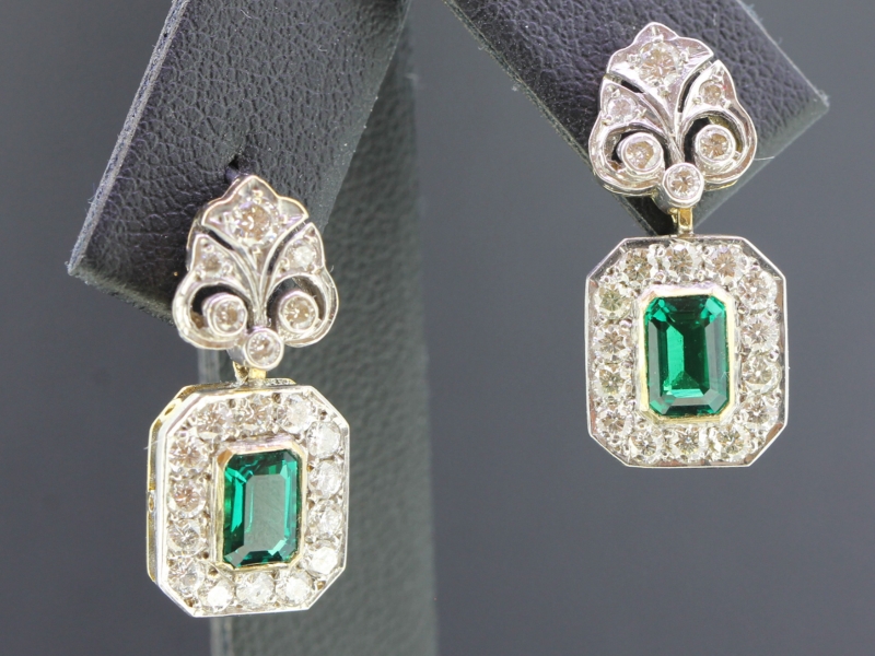  entrancing emerald and diamond 18 carat gold earrings
