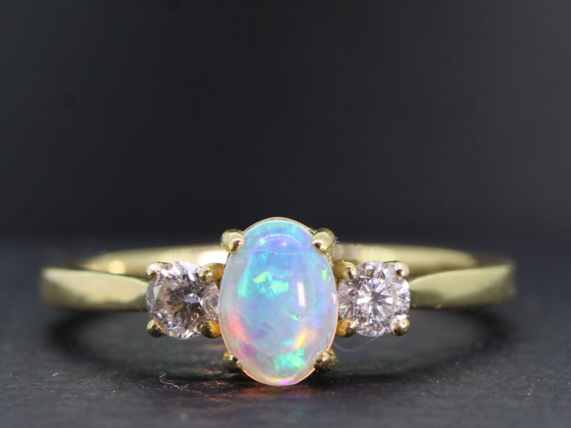 Beautiful opal and diamond three stone 18 carat gold ring