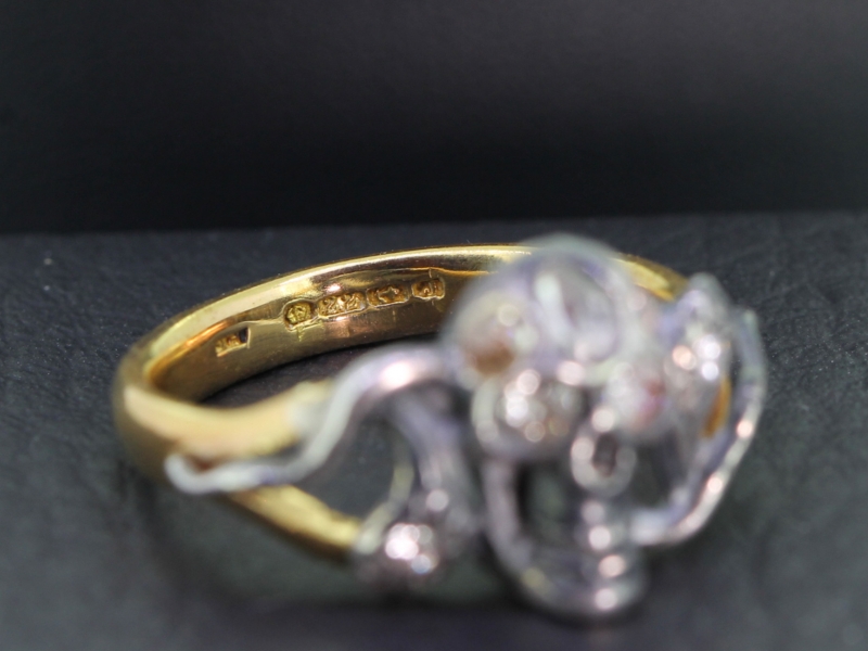 Magnificent 22 carat gold silver set diamond skull and serpent ring