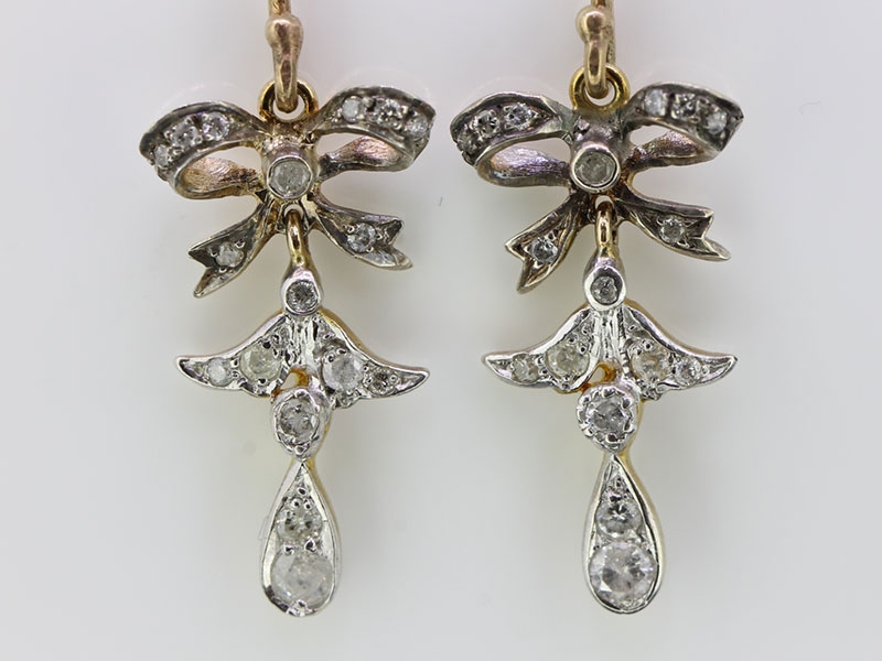 Pretty fleur- de- lis diamond 9 carat gold earrings