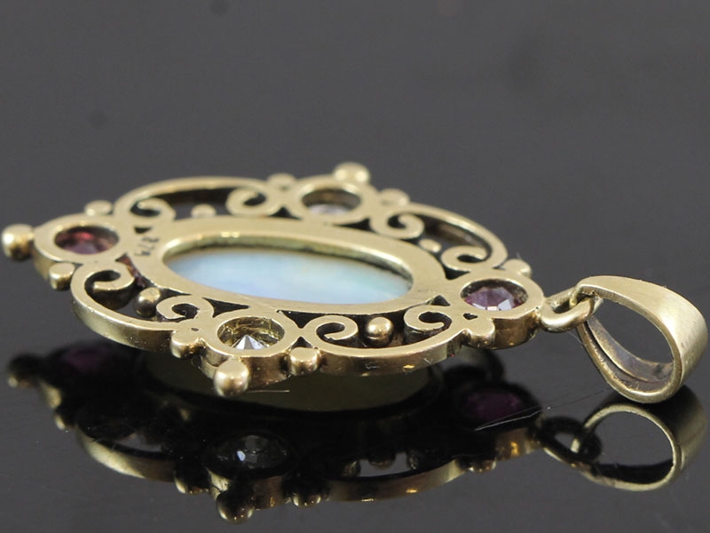 Stunning opal, ruby and diamond  9 carat gold pendant