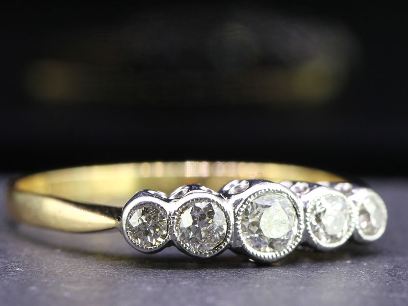 Charming five stone 18 carat gold and platinum ring