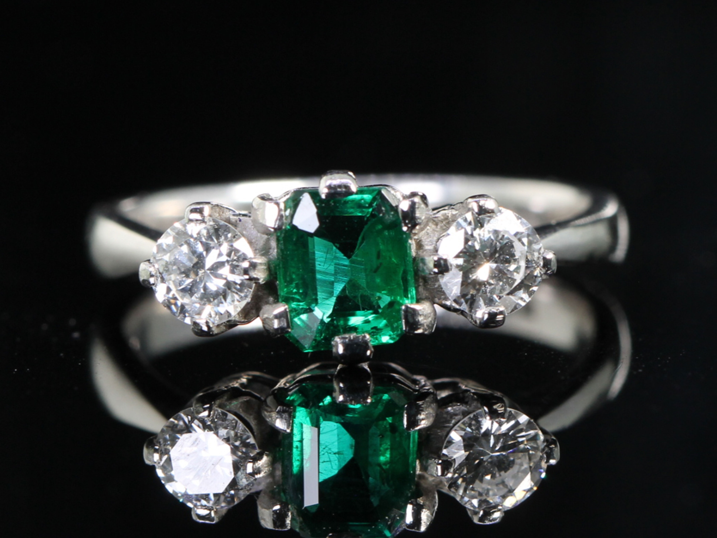 Vintage dates 1959 emerald and diamond platinum trilogy ring