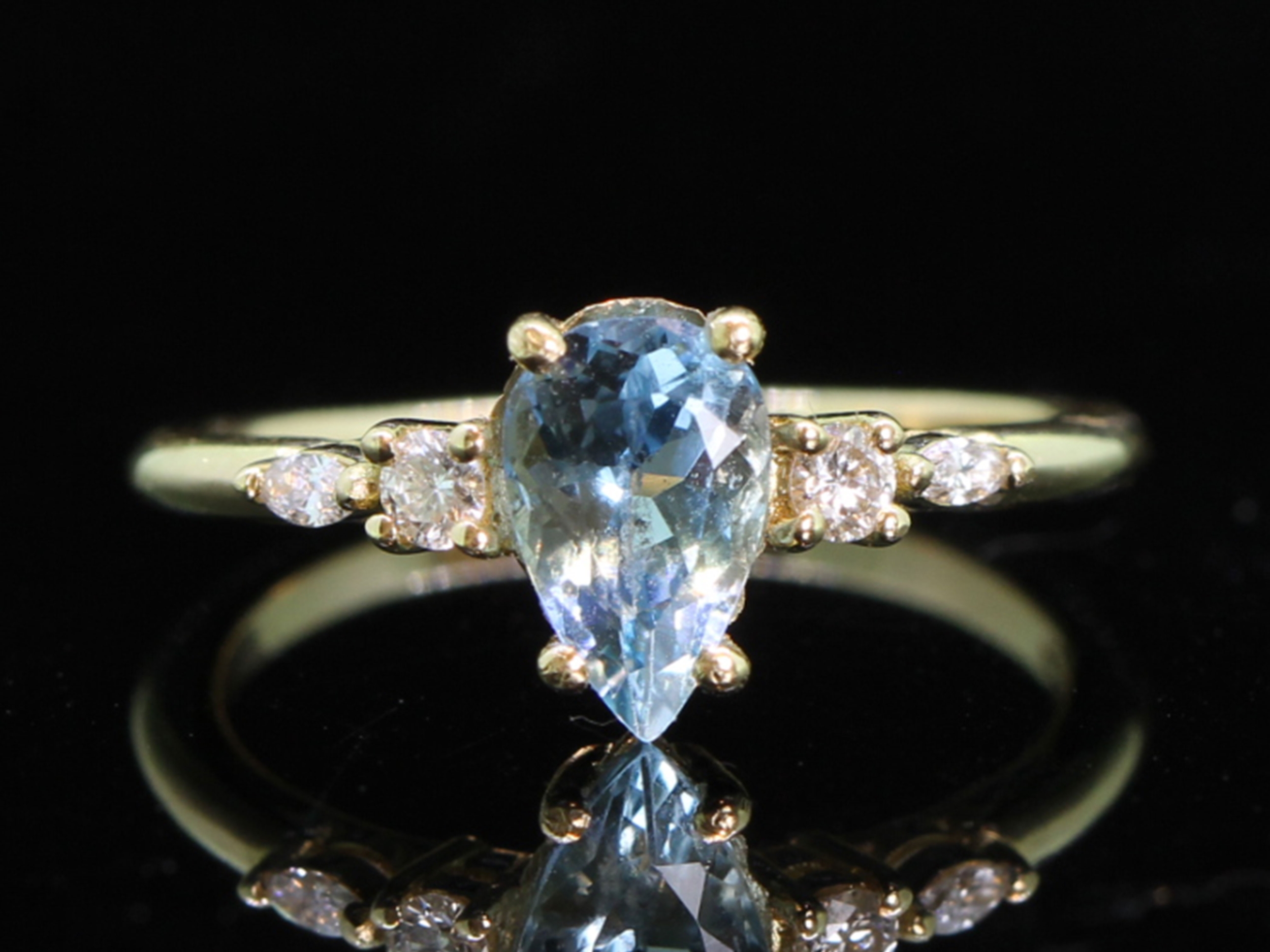 Floral inspired pear cut aquamarine and diamond 18ct gold ring 
