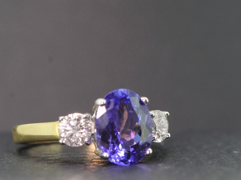 Magnificent aaa tanzanite and diamond 18 carat gold trilogy ring 