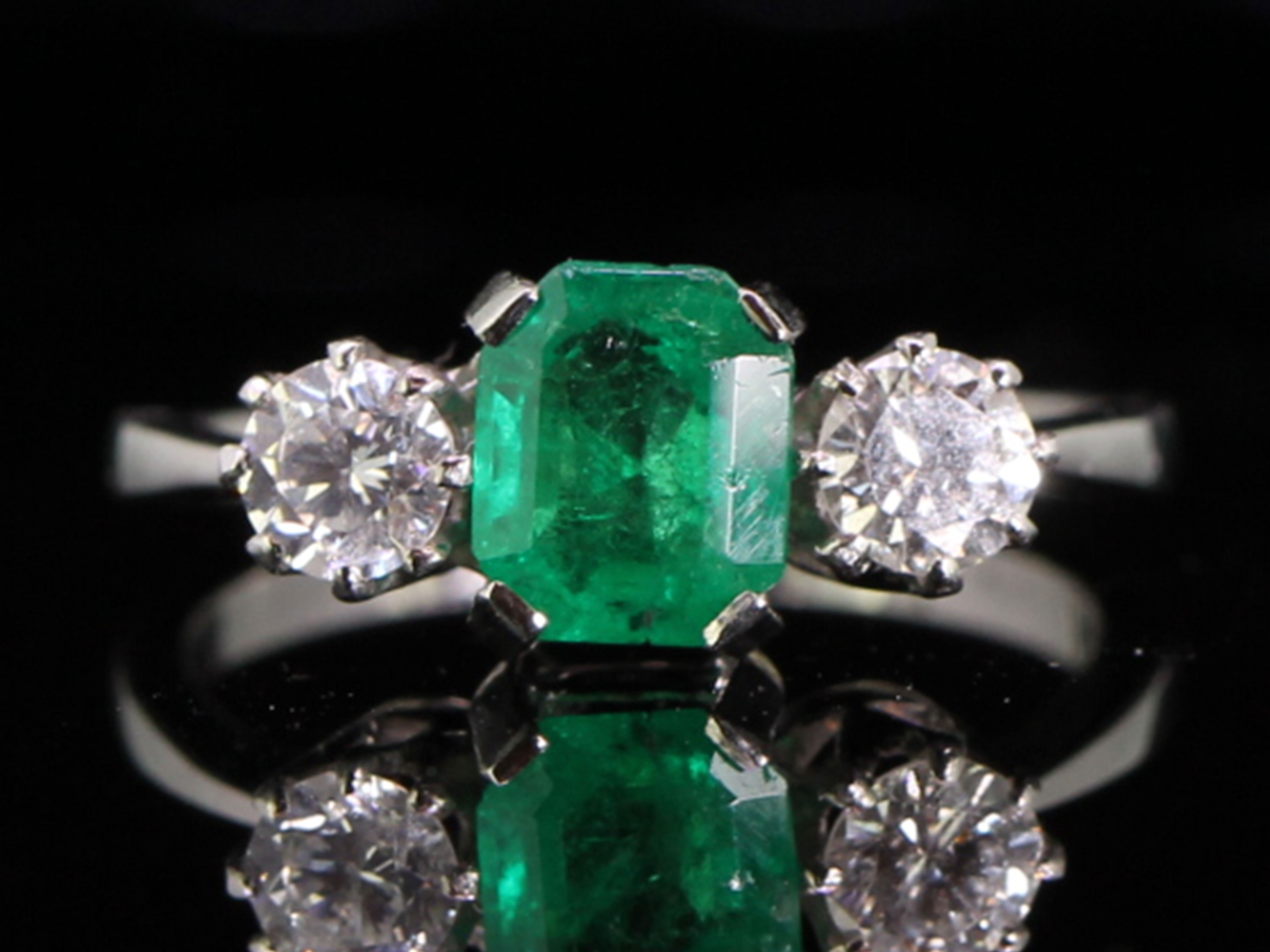 Beautiful emerald and diamond platinum trilogy ring