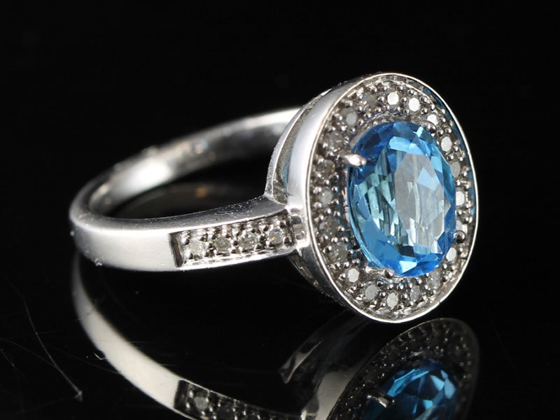 Amazing blue topaz and diamond  9 carat gold cocktail/dress ring 		