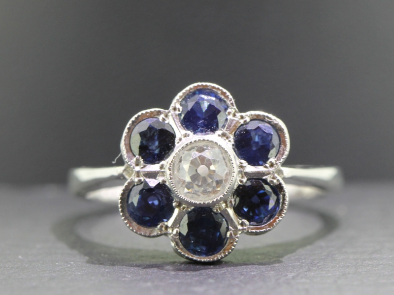 Dramatic sapphire and diamond daisy cluster 18 carat gold ring