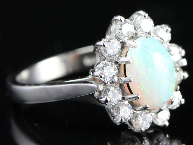 Breath taking australian opal and diamond 18 carat gold cluster ring