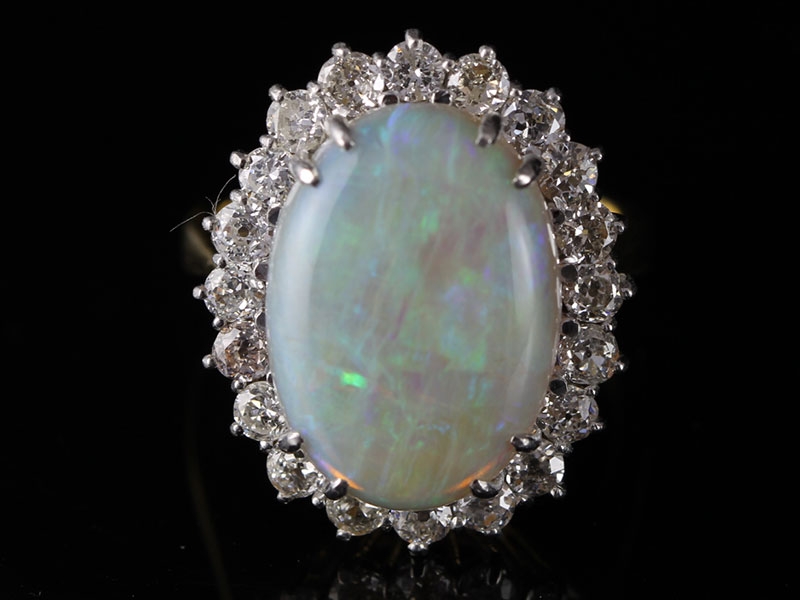 Magnificent 6 carat opal and diamond cluster 18 carat gold ring