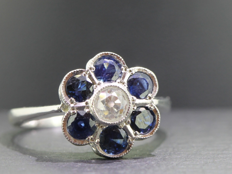 Dramatic sapphire and diamond daisy cluster 18 carat gold ring