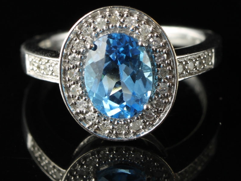 Amazing blue topaz and diamond  9 carat gold cocktail/dress ring 		