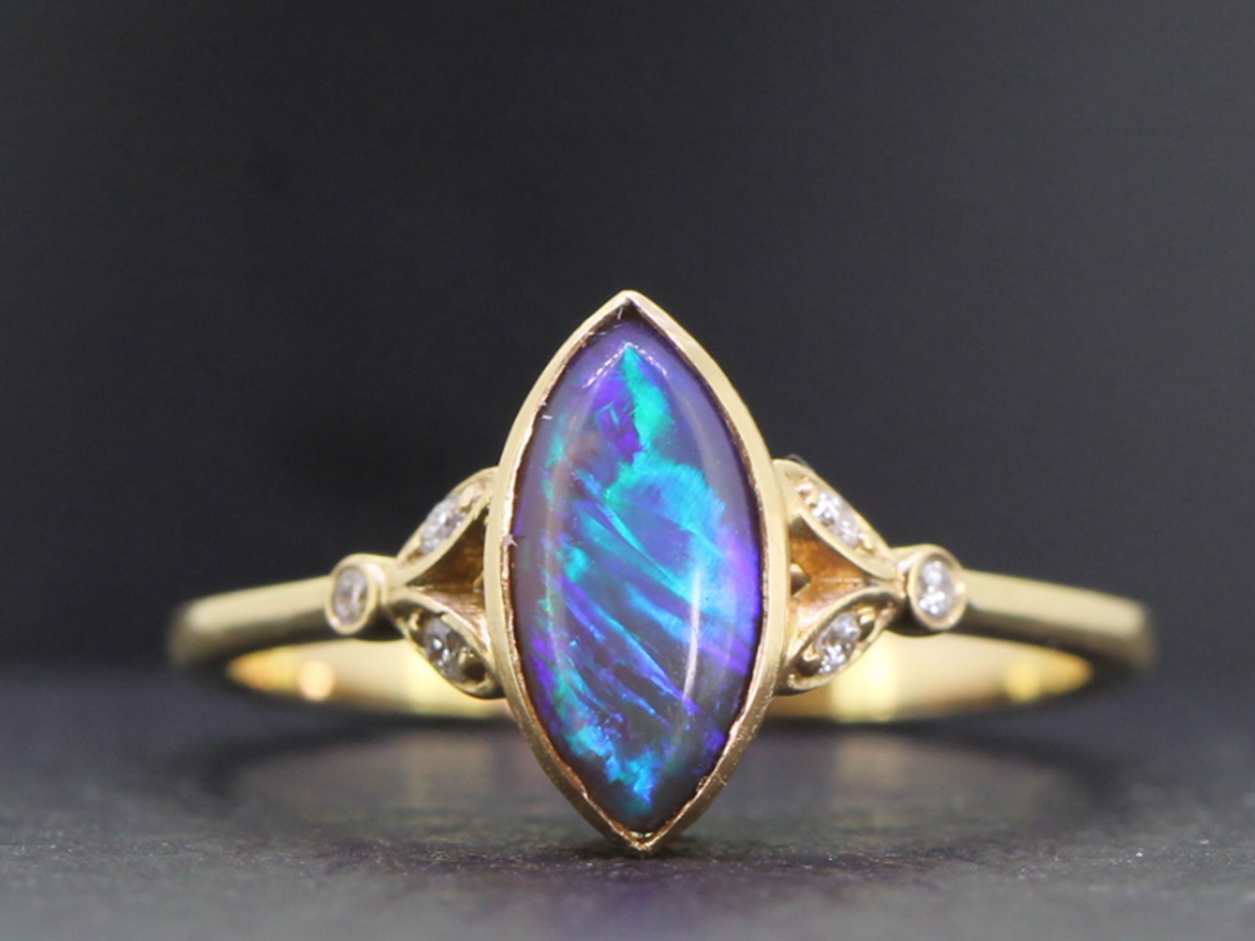 Stunning solid black opal and diamond 14 carat ring