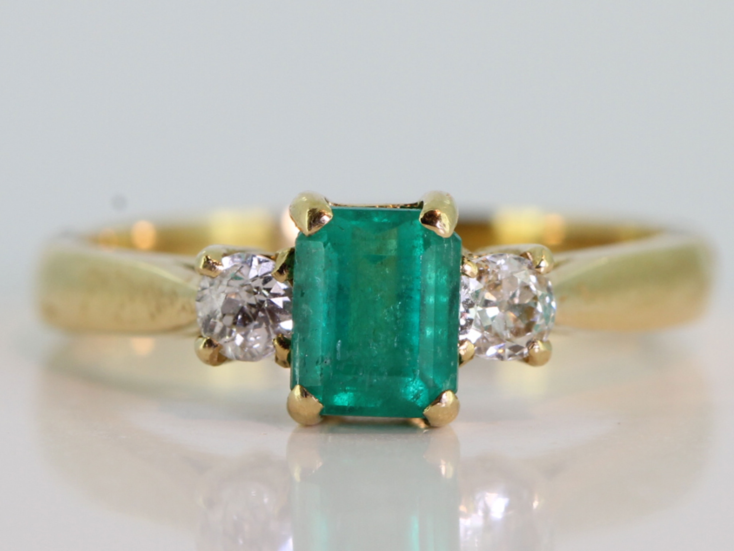  pretty emerald and diamond trilogy 18 carat gold ring