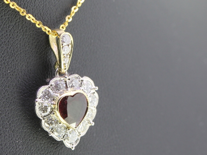 Elegant ruby and diamond platinum and 18 carat gold heart pendant