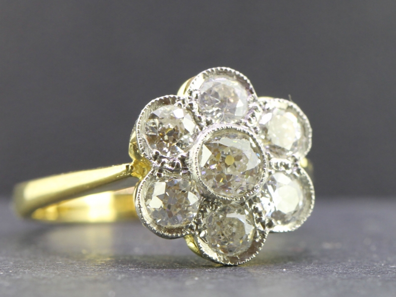Stunning vintage diamond daisy platinum and 18 carat gold ring