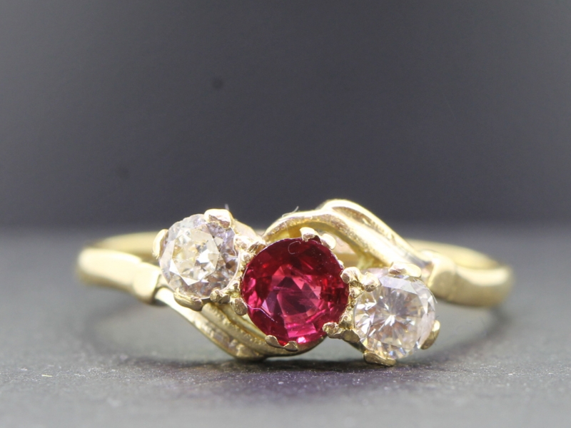 Beautiful edwardian ruby and diamond on a twist 18 carat gold ring