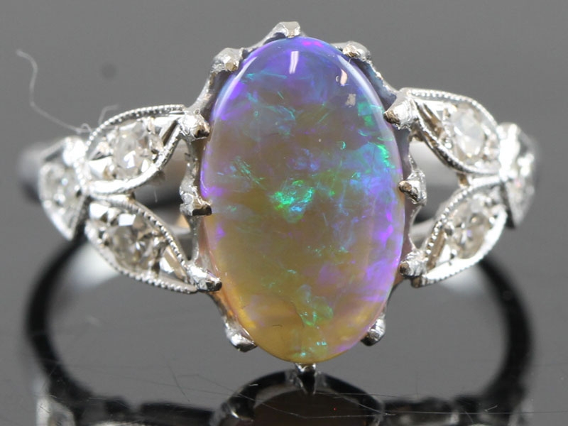 Stunning black opal and diamond 18 carat gold ring